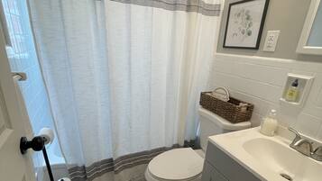 Combined shower/tub, hair dryer, towels, soap