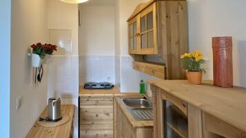 Fridge, microwave, stovetop, coffee/tea maker