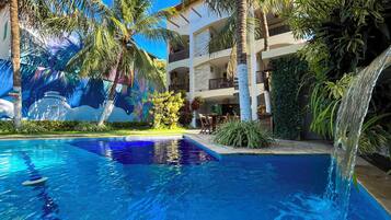 Outdoor pool, open 9:00 AM to 9:00 PM, pool umbrellas, pool loungers