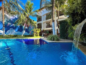 Outdoor pool, open 9:00 AM to 9:00 PM, pool umbrellas, pool loungers