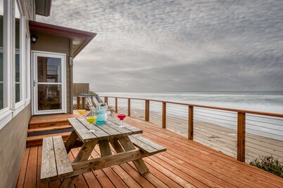 Enjoy the beach from this Ocean Front home with a Hot Tub and Large Deck