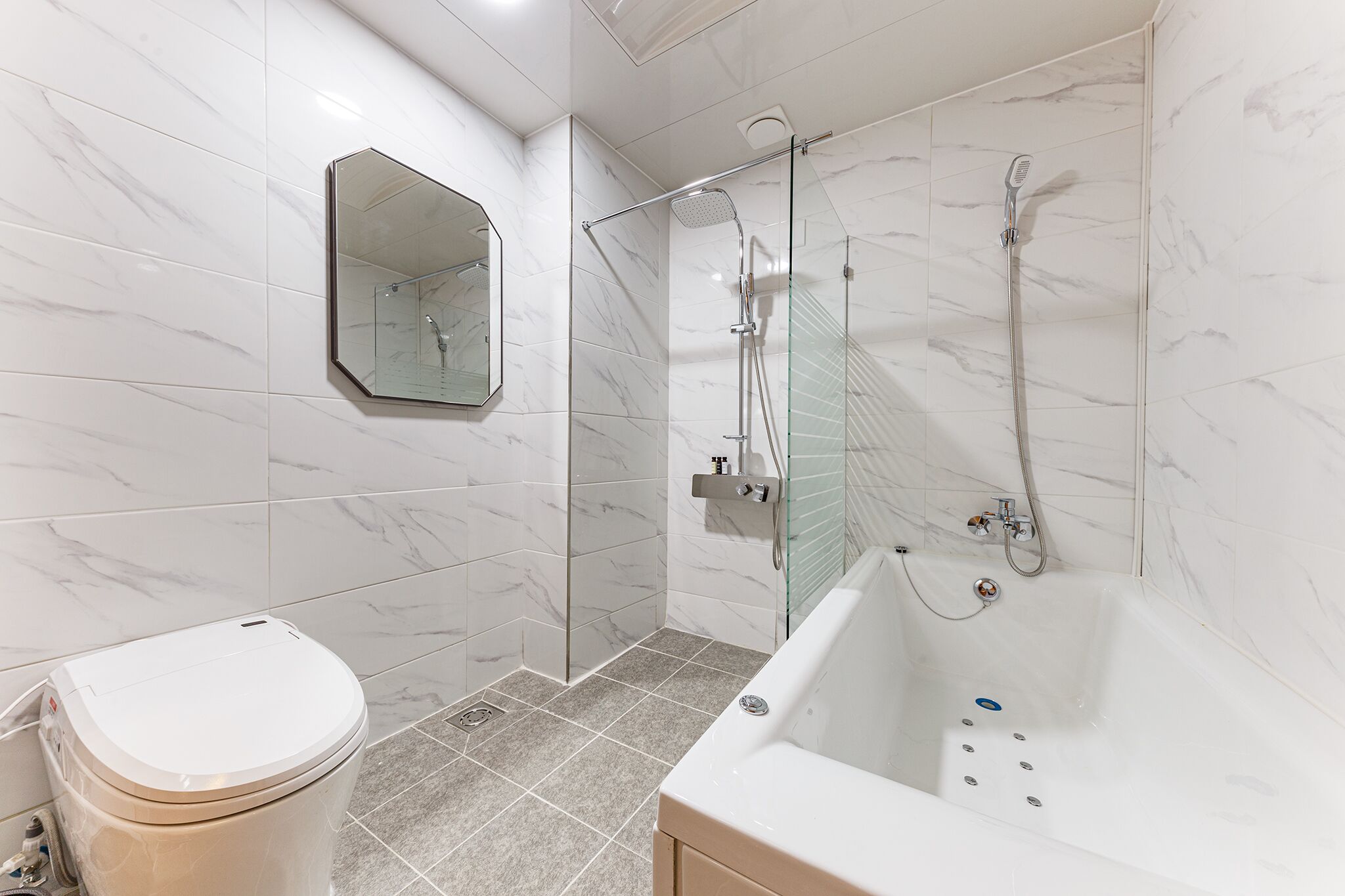 jetted bath, rainfall showerhead, designer toiletries, hair dryer