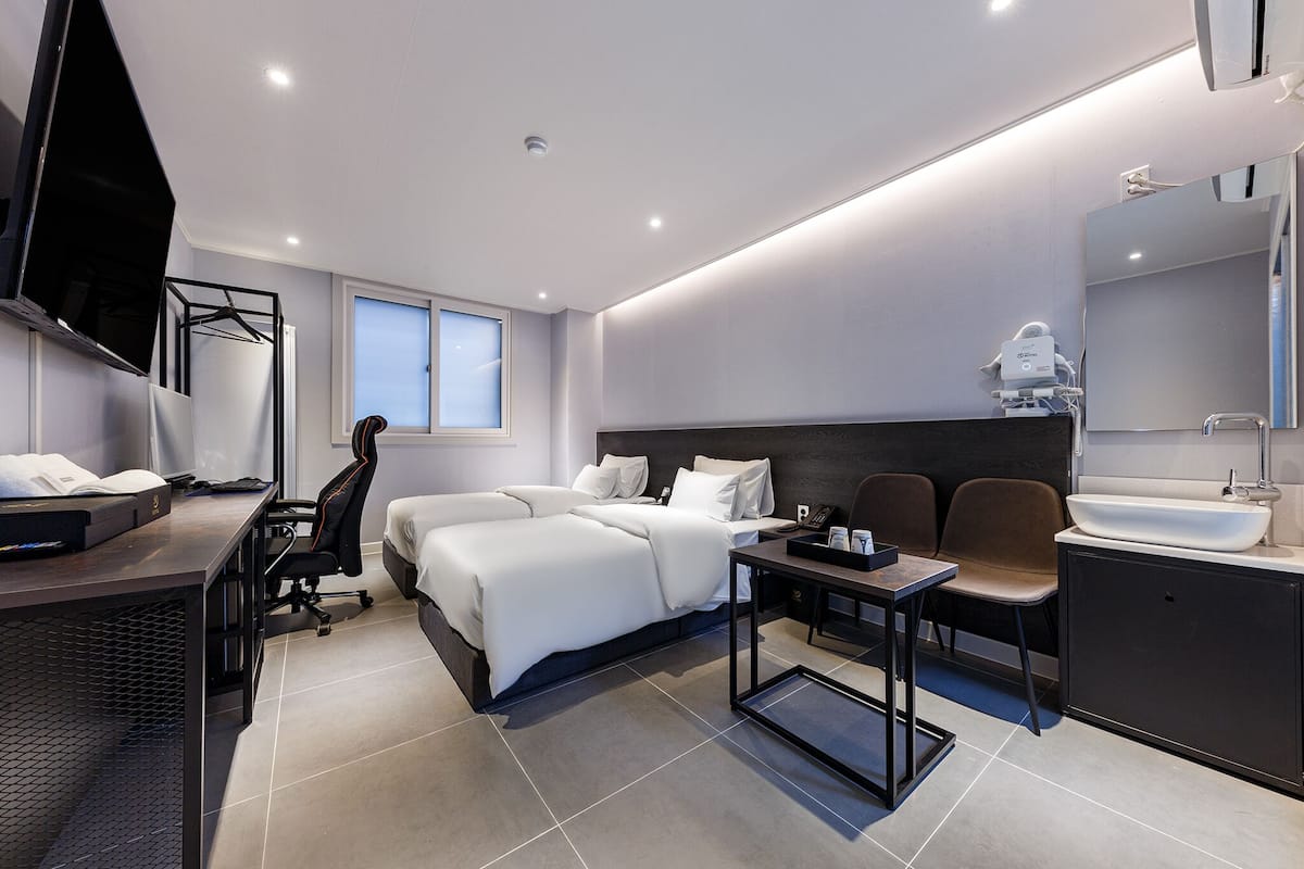 Premium bedding, down comforters, pillowtop beds, free minibar