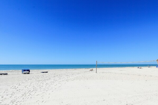 Enjoy beach activities like volleyball on the expansive beach.