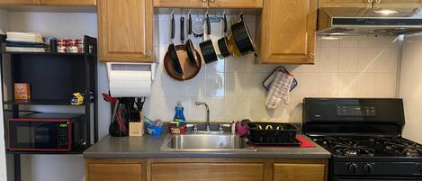 Microwave, coffee/tea maker, cookware/dishes/utensils