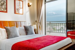 Deluxe Double Room, Balcony, Mountain View | In-room safe, desk, soundproofing, iron/ironing board