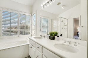 Combined shower/tub, hair dryer, towels, soap