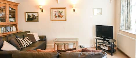 Cottage | Woonruimte | Een dvd-speler