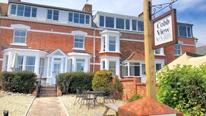 A two-story brick building with a sign reading "Cobb View No 3 Ozone Terrace." - 2 Cobb View (Lyme Regis)