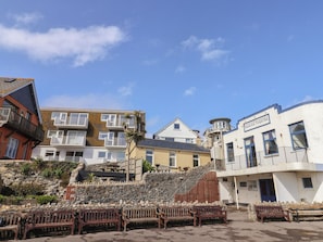 A coastal town with a variety of buildings, including a theater and residential structures. - 1 Bay View Court (Lyme Regis)