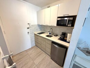 Microwave, stovetop, coffee/tea maker, toaster