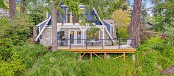 Gorgeous bay front gem with decks, grill, fireplace, wood stove, & private sauna