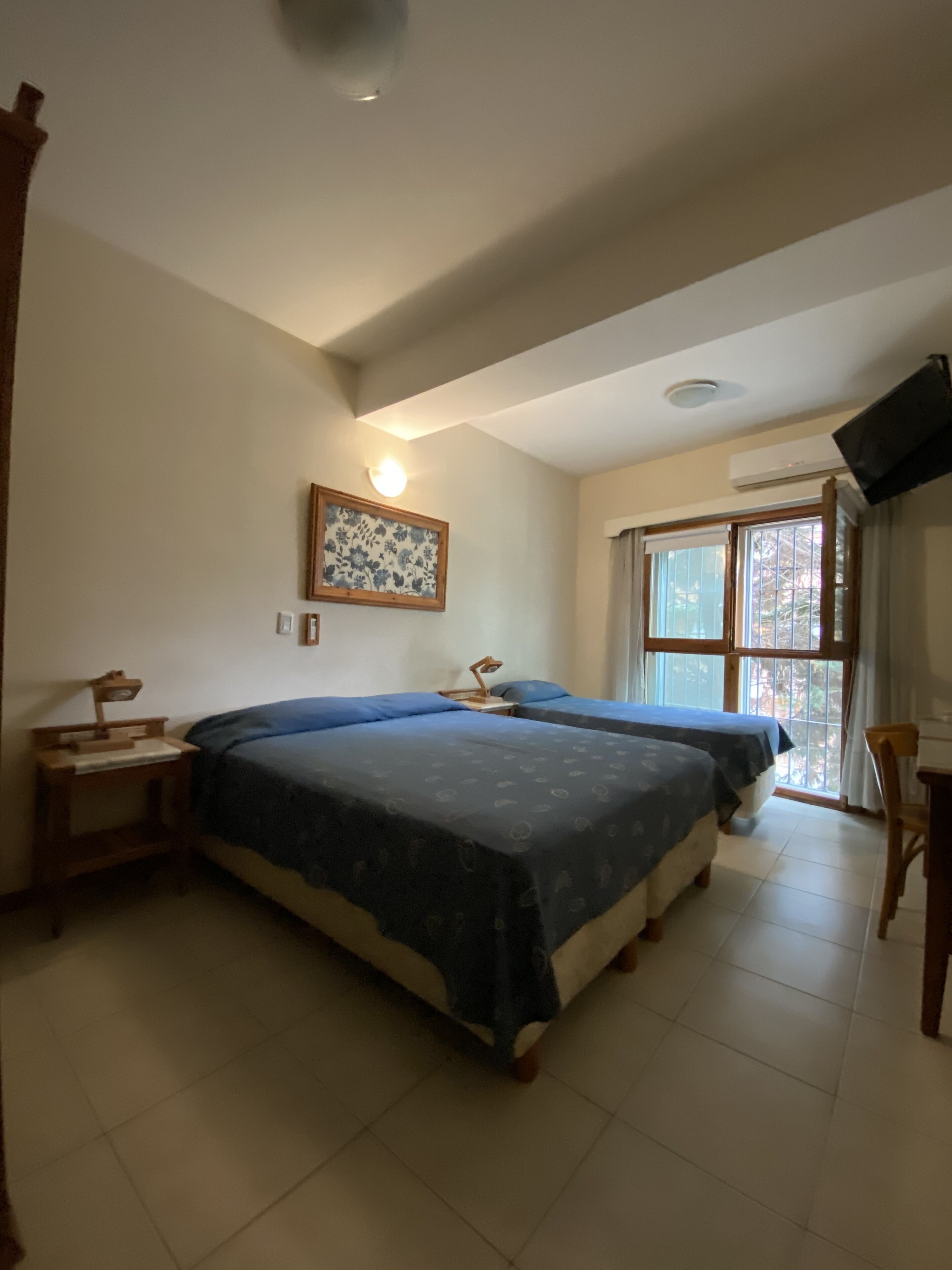 Desk, laptop workspace, iron/ironing board, travel crib