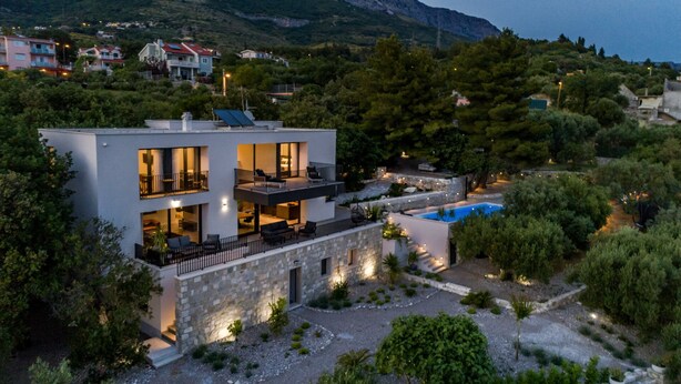 A modern two-story house with a swimming pool, surrounded by trees and a mountainous backdrop. - Villa Maremonte with Pool (Kaštel Kambelovac)
