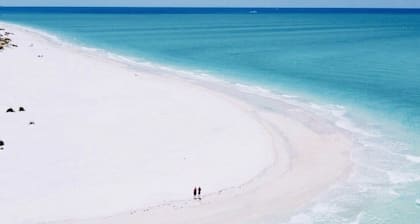 Two story condo with ocean on one side and bay on other only steps away