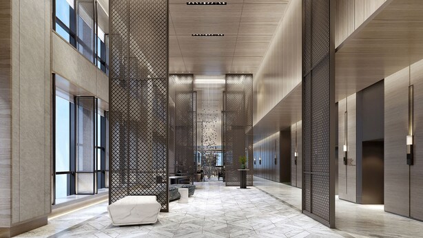 Un interior moderno con un pasillo central, separadores decorativos y una zona de estar.