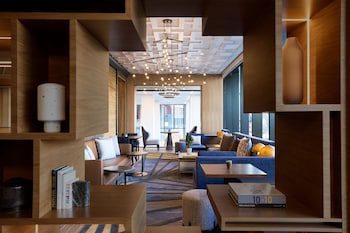 A modern gym with treadmills, weight machines, and free weights. at Washington Marriott Capitol Hill