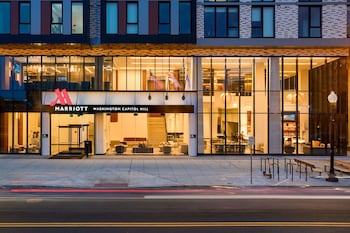 A spacious lobby with modern furniture, large windows offering city views, and a clean, contemporary design. at Washington Marriott Capitol Hill