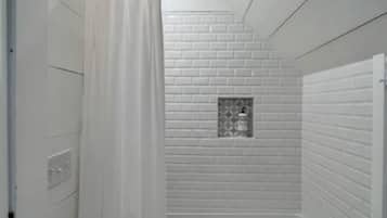 Combined shower/tub, hair dryer, towels, soap