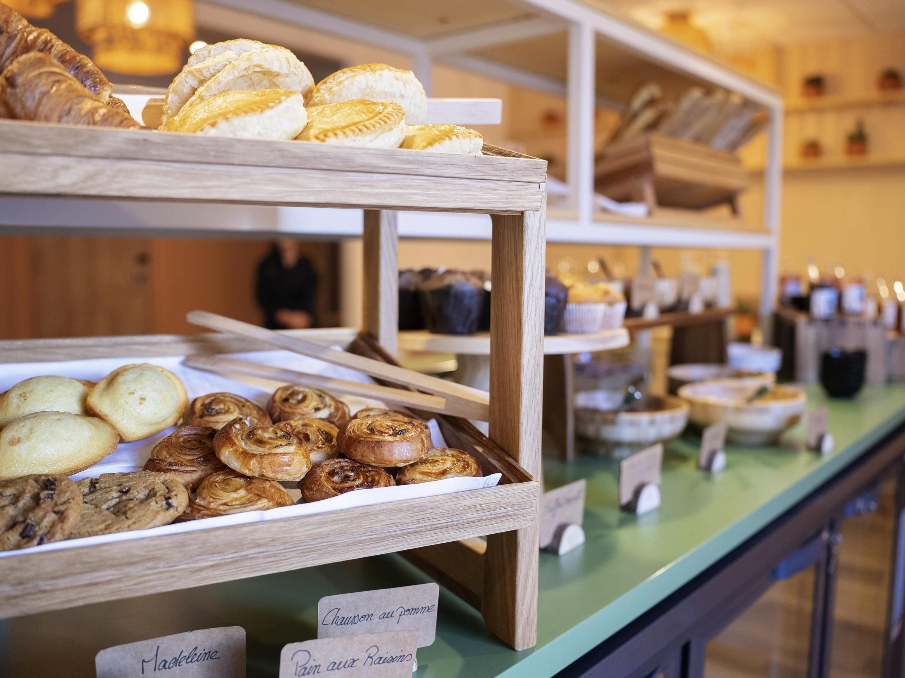 A bakery display with various baked goods.