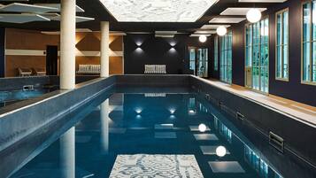 Indoor pool, open 9:30 AM to 7:30 PM, pool umbrellas, pool loungers