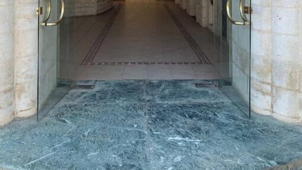 The entrance to the International Stars Hotel with a stone archway and a marble floor. - %ECONOMY APARTMENT% 101 (Amman)