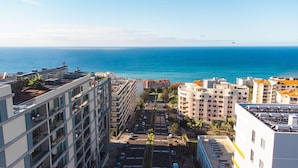 A high-rise building with a view of the ocean and other buildings. - Terrace Apartment by Atlantic Holiday (Funchal)