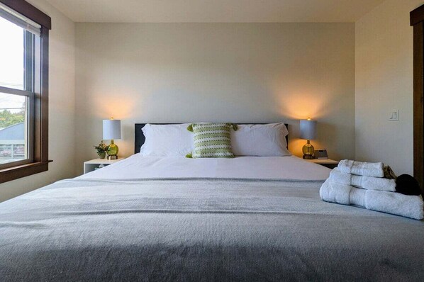 1 bedroom, desk, iron/ironing board, travel crib