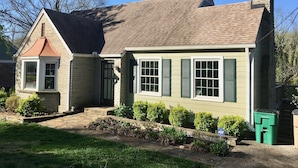 A two-story house with a brick facade, green shutters, and a chimney. - Sweet little apartment with hot tub,gazebo,and an acre backyard! Walkable area! (Nashville)