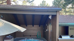 A covered outdoor swimming pool area with a hot tub, a bench, and a trash bin. - Perfect Family & Dog Friendly 2 Story Condo, Sleeps 8+, 1 Mile To Village,  #66 (Mammoth Lakes)