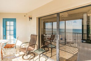 Enjoy a meal or relax on the balcony with a scenic beach view.