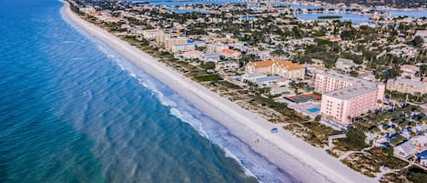 Experience the charm of a coastal town with a wide beach and scenic views.