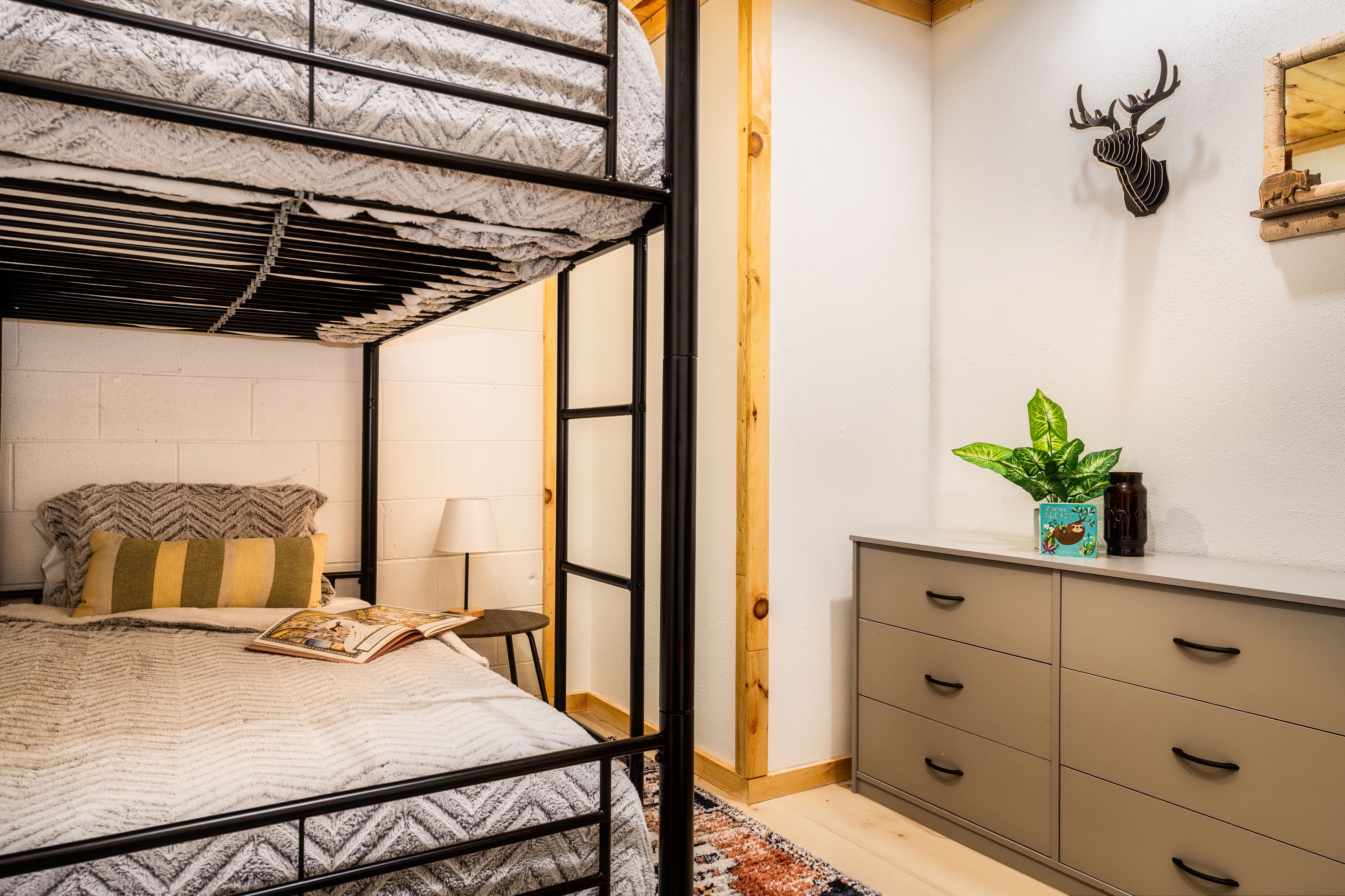 This cozy bunkroom also has a large dresser