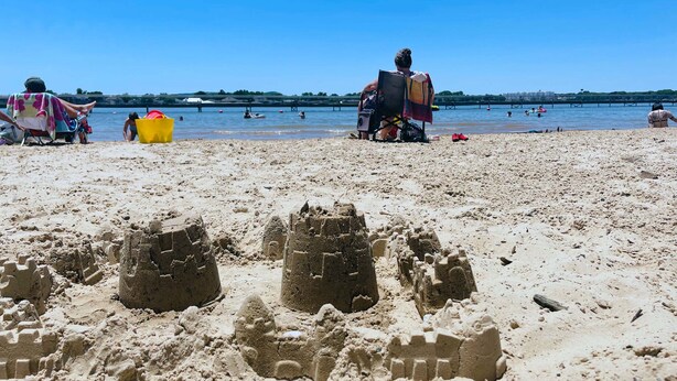 A sandy beach with sandcastles and people in the background. - Waterfront / Beauty Bar / Family Fun / 2 King Beds (Granbury)