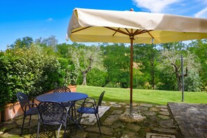 An outdoor patio with a table and chairs, a canopy, and a stone pathway. - Francigena 4, Castelfiorentino, Italy (Castelfiorentino)