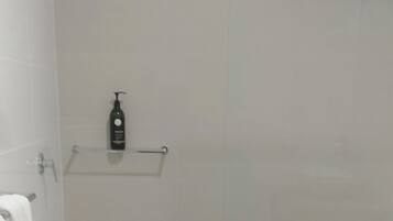 Bathtub, hair dryer, towels, soap