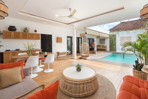 Exclusive Villa | Living area | 32-inch Smart TV with satellite channels, streaming services - Villa Greco by Villa Finder (Canggu)
