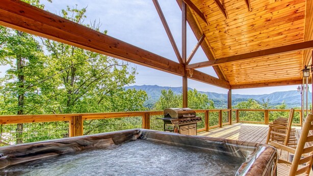 A hot tub area with a view of mountains.