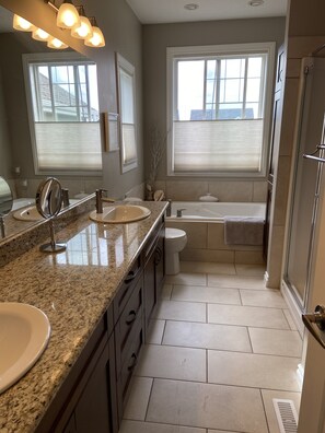 Combined shower/tub, jetted tub