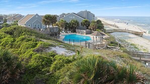 A beachfront property with a swimming pool, a wooden deck, and a beach view. - Barrier Dunes 281 - 8 Branch Office (Port St. Joe)