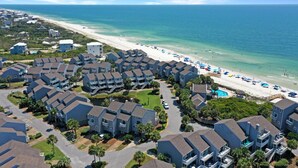 A coastal residential area with beachfront properties, a sandy beach, and a clear view of the ocean. - Barrier Dunes 497 - 33 (Port St. Joe)