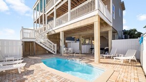 A two-story house with a covered patio area, a swimming pool, and outdoor seating. - Gulf-Front Estate with Private Pool (Indian Pass)