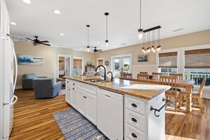 Enjoy family meals in this well-equipped kitchen with a central island and dining area.