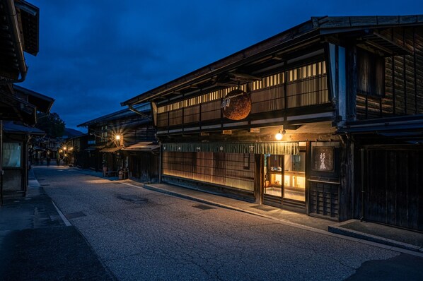 A traditional wooden building with a large entrance and a hanging lantern. - BYAKU Narai (Shiojiri)