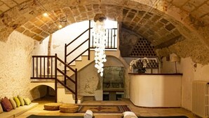 A yoga studio with mats arranged in rows, a staircase, and a rustic stone ceiling. - León de Sineu - Ten Bedroom Villa, Sleeps 21 (Sineu)