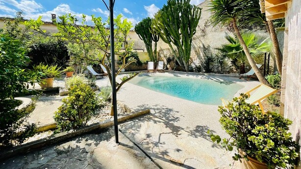 A pool area with a pergola, lounge chairs, and various plants. - León de Sineu - Ten Bedroom Villa, Sleeps 21 (Sineu)