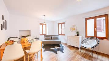 Family Villa, Multiple Bedrooms (Casa Elvezia) | Living area | 21-inch flat-screen TV with cable channels, fireplace