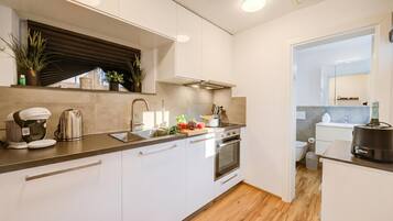 Family Villa, Multiple Bedrooms (Casa Elvezia) | Private kitchen | Fridge, oven, stovetop, dishwasher
