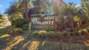 A sign for a private resort community with a house number 223. - Elegant Condo in the Heart of Northern Myrtle Beach close to beach (Myrtle Beach)