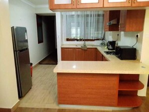 Apartment | Private kitchen | Fridge, microwave, stovetop, toaster - Stay.Plus Skyline Executive Apartment (Nairobi)